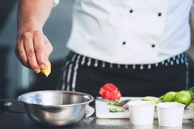 Squeeze the lemon into the ceviche mixing bowl. 