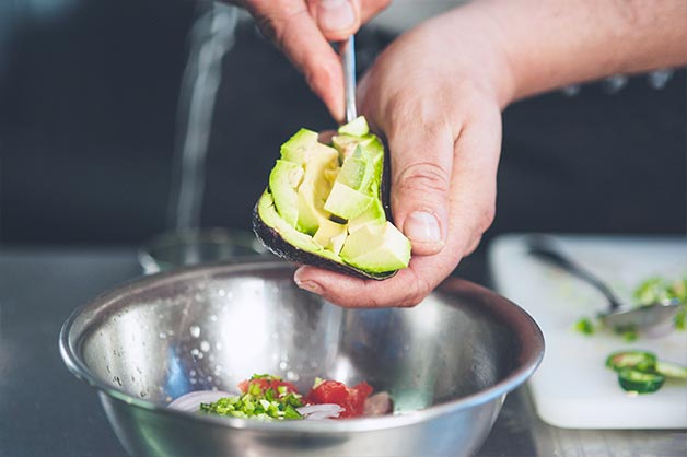 Add the diced avocado to the ceviche mix. 