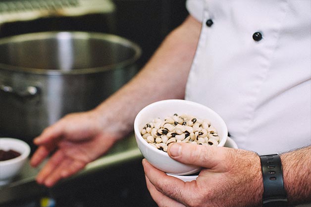 Once simmering, add bean variations and mix well