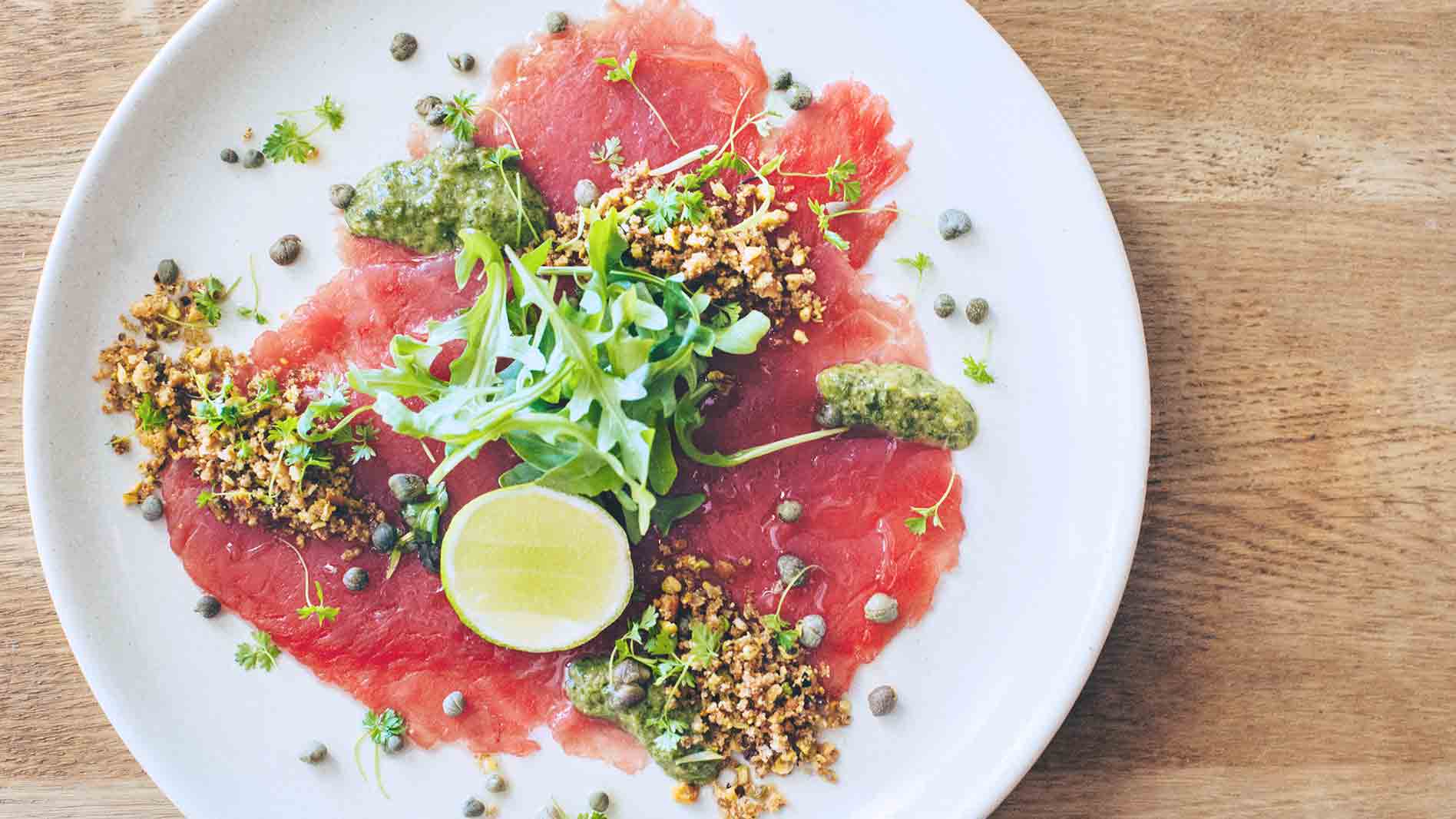 Tuna Carpaccio with Pistachio and Olive Crumble