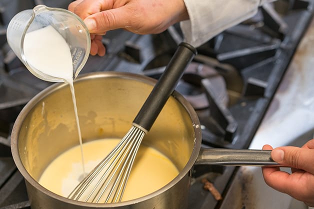 Pouring in milk to the pot