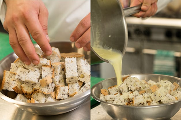 Cutting the bread and putting in a mixing bowl