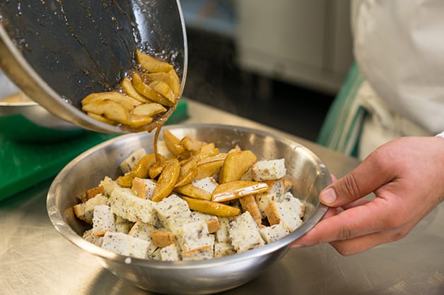 Adding the cooked apples to the bread