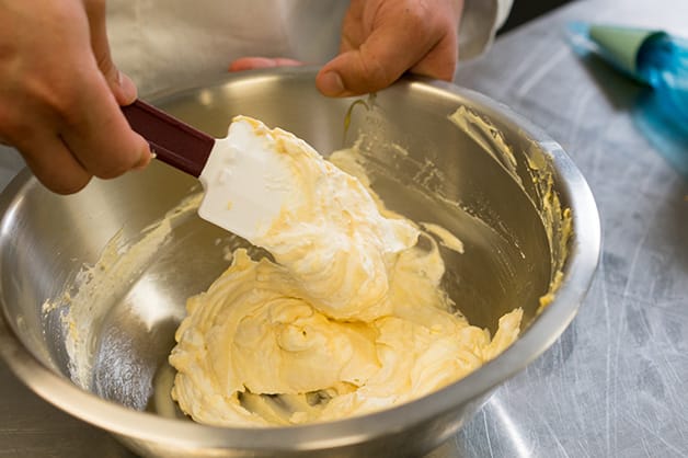 Adding cream to custard mix