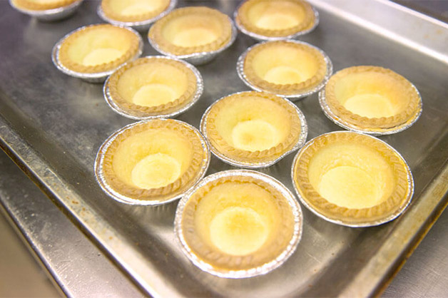 Baked pastry shells in a tray