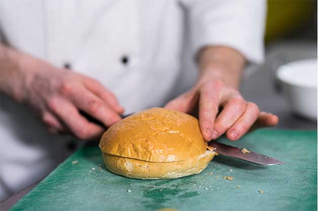 Photo of the chef slicing the milk bun