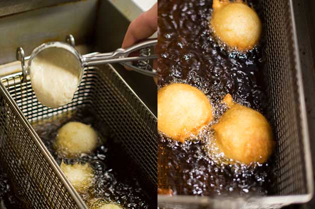 The image shows the donuts being fried in a deep-fryer