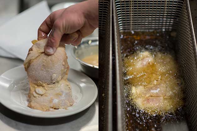 Photo shows the chef coating the chicken with flour and then deep-frying it