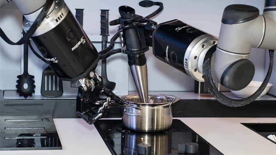 A picture of the Moley robotic kitchen working away