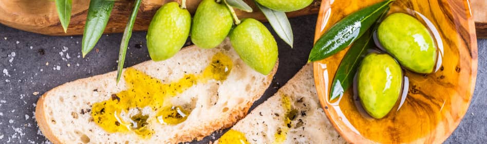 Photo of Olive Oil being drizzled over some fresh bread