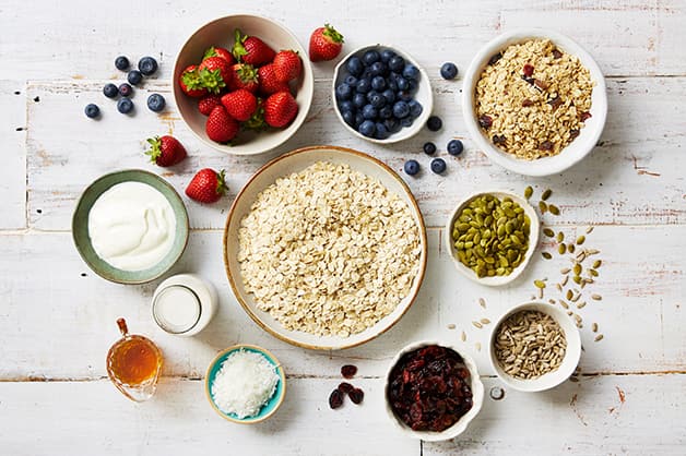 Image shows all the raw ingredients for the bircher recipe