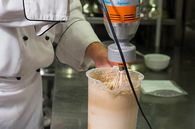 The chef is pictured creating creme whip