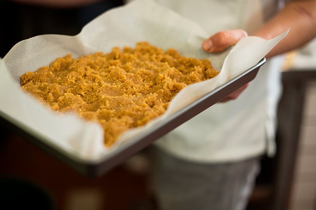 Adding mixture to the oven 