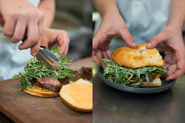 The chef is then seen adding the rocket and top of the bread