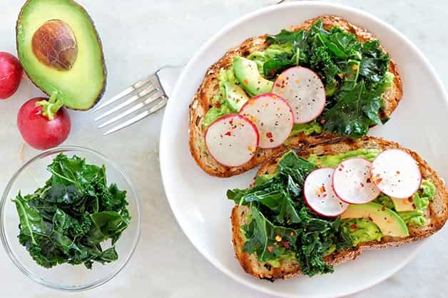The photo shows toast with avocado