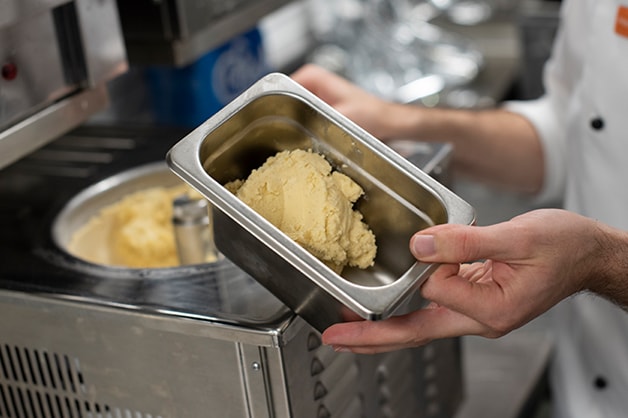 Churning the mixture in an ice cream machine