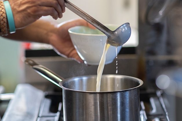 Pouring milk into the pot