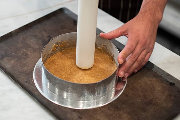 Forming the biscuit base for the cheesecake