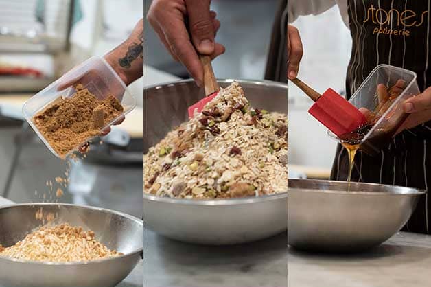 Adding dried fruit and sugar to the granola mix