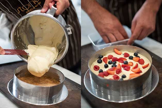 Adding the mix to the pan and topping with berries