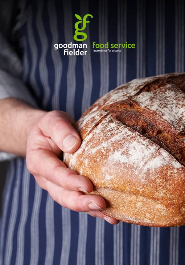 Poster of baker holding a crusty bread loaf