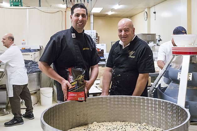 Bakers holding a bag of chocolate