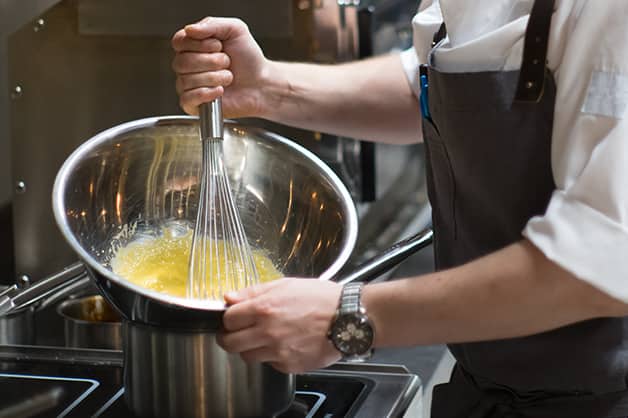 Image is of a chef performing the Emulsify technique