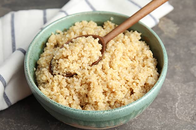 The photo shows a bowl of cooked quinoa