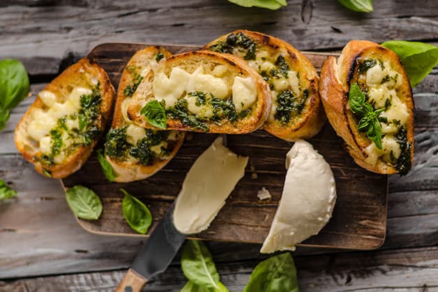 Image is of four slices of garlic bread