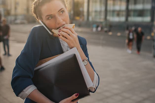 Image of female eating on the go