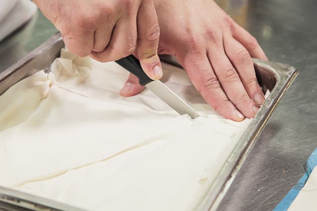 Slicing the Pampas Filo Pastry with a sharp knife
