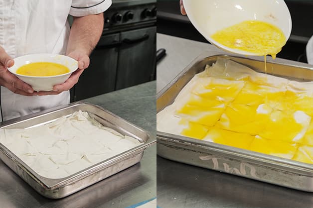 Pouring melted butter over the baklava