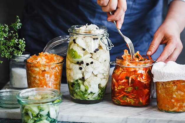 Image of four jars filled with fermented goods