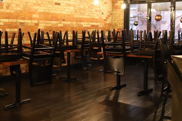 Chairs stacked in an empty restaurant