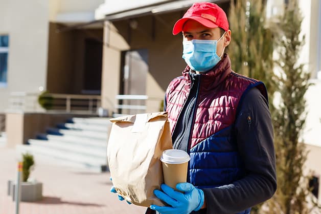 Ordering takeaway food with mask and gloves