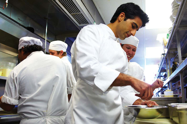 Chefs preparing food in the kitchen