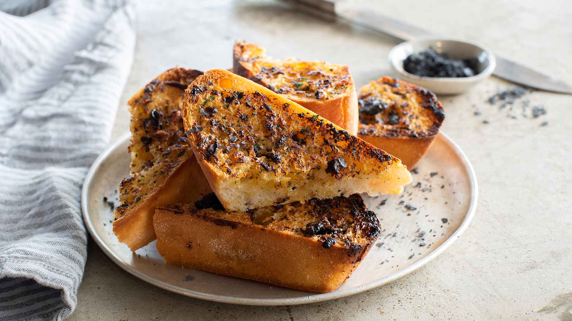 Image Of The Black Garlic Bread With Lava Salt