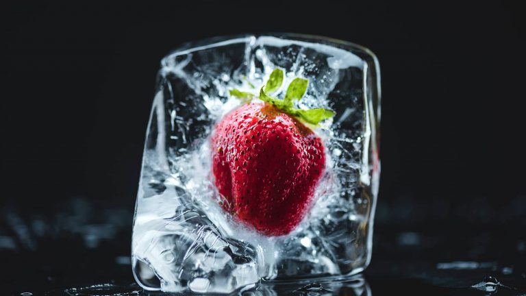Strawberry frozen in ice