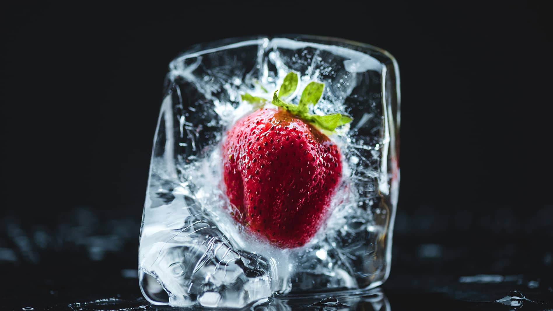 Strawberry frozen in ice