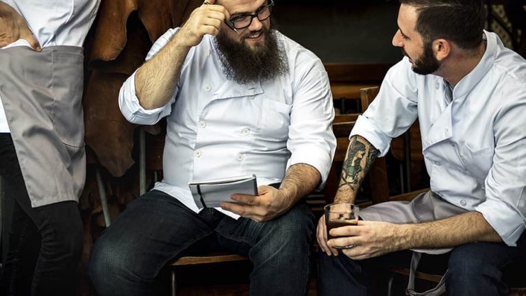 Two chefs sharing a chat