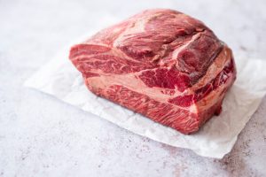 This is a cut of beef, specifically a ribeye with rich marbling